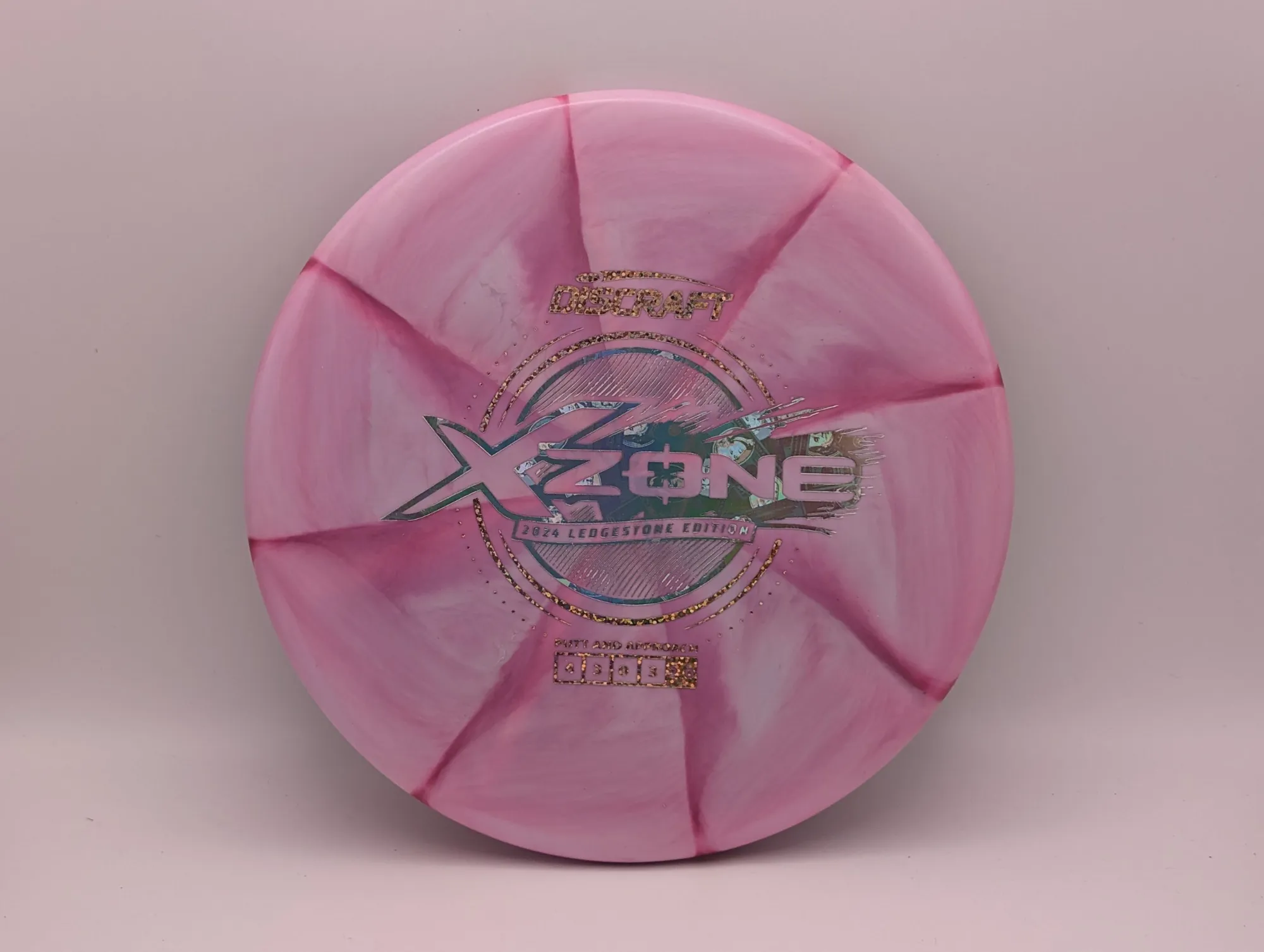 Photo of this disc, X Swirl, 173-174 g, Pink/Money, D7501